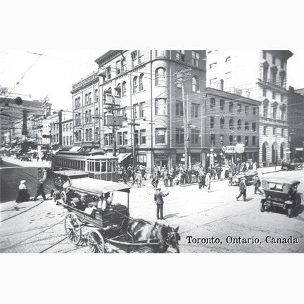 Downtown Toronto King Street and Yonge Street intersection with a streetcar, cars and a horse-drawn wagon being directed by a policemen circa 1912