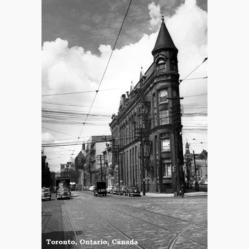 View of the Gooderham and Worts Flatiron Building between Wellington Street and  Front Street at Church Street with cars, one a Diamond Taxi. Toronto circa 1947.