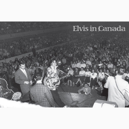 Elvis Presley in a gold jacket looks back to the photographer during a show at Maple Leaf Gardens Toronto with a sitting audience behind 1957